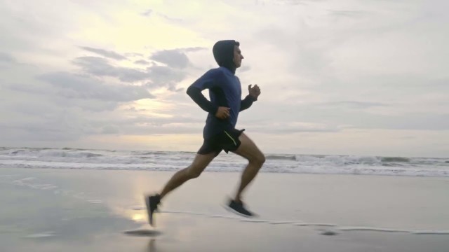 'A man Running On the Beach Shore-Fitness'