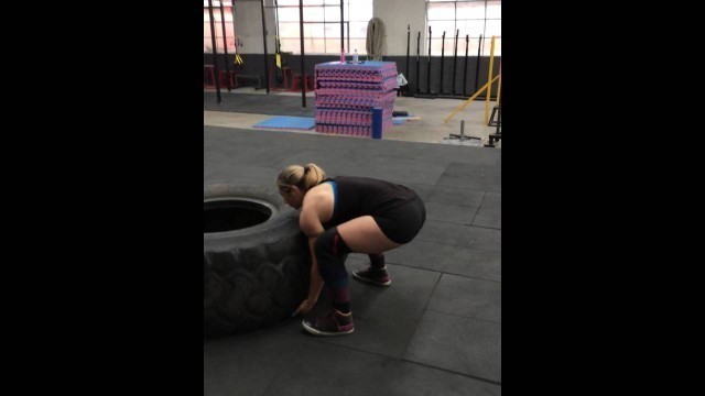 'Be Strong Fitness Geelong Co-Owner and Head Coach flips a 250kg tyre'